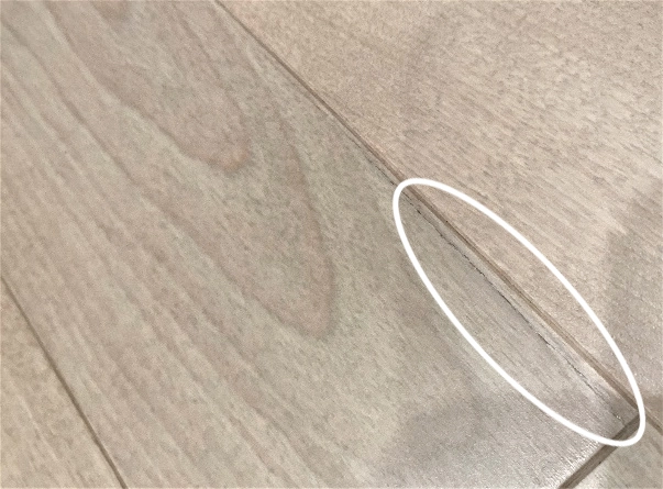 fine crack on a floorboard